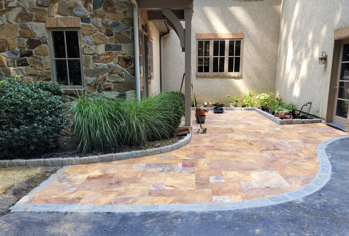 Custom natural stone masonry and multicolor paver patio installation in Concord, CA